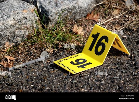 Crime Scene Evidence Marker Next To Syringe Stock Photo Alamy