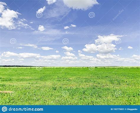 Magical Deep Aerial White Clouds On Blue Sky And Green Field Stock