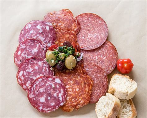 Salami Rosette With Slices Of Bread Garnished Olives Stock Photo