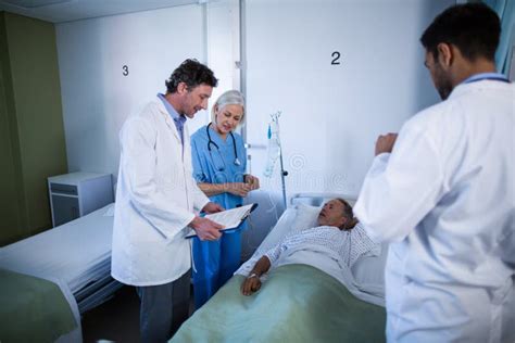 Doctor And Nurse Examining A Patient Stock Image Image Of Exam