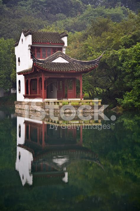 While traditional chinese houses are nothing worth bragging about, chinese gardens. Traditional Chinese House IN A Lake Stock Photos ...