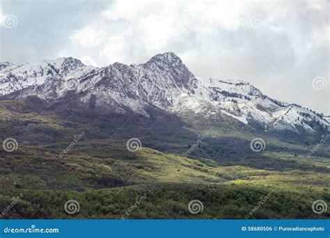 Peak With Utah Snow Capped Mountains With Rolling Green Hills Stock
