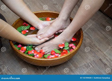 female feet at spa pedicure procedure spa foot massage massage of woman`s foot in spa salon