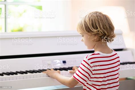 Child Playing Piano Kids Play Music Stock Photo Download Image Now