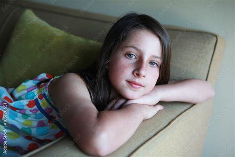 Pre Teen Portrait Of Brown Haired Girl With Freckles Stock Photo
