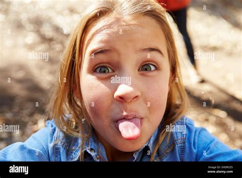 girl sticking out tongue grimace girls poking tongues sticking out tongues grimaces stock