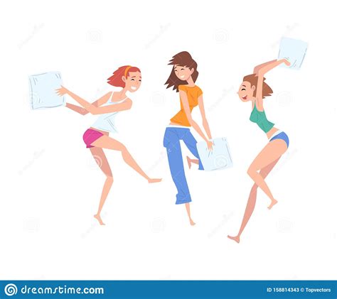 beautiful girls dressed in pajamas playing pillow fight at slumber party group of girlfriends