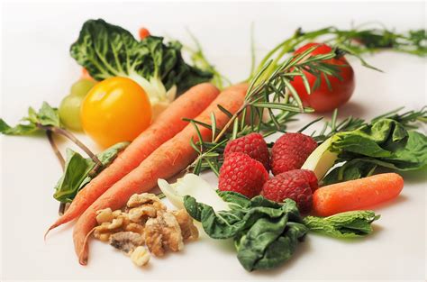 Healthy Foods Carrots Kale Walnuts Tomatoes And Strawberries