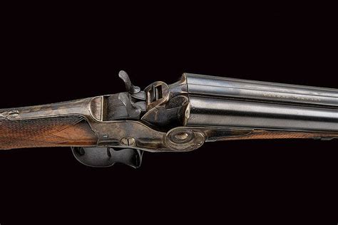 A Breech Loading Double Barrelled Shotgun With Nagant And Re