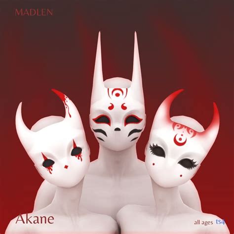Three White Masks With Red And Black Designs On Them