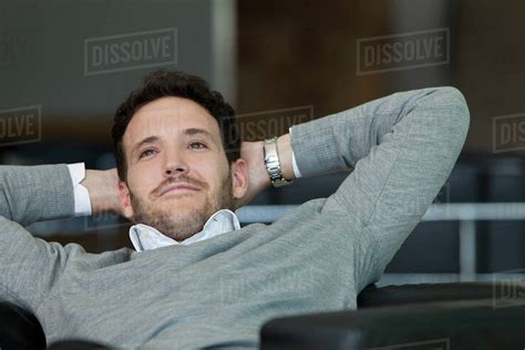 Businessman Relaxing With Hands Behind Back Stock Photo Dissolve