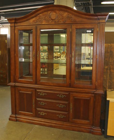 Overlapping wood drawer and door fronts give the collection its name. Tall China Cabinet Solving Storage Issues - HomesFeed