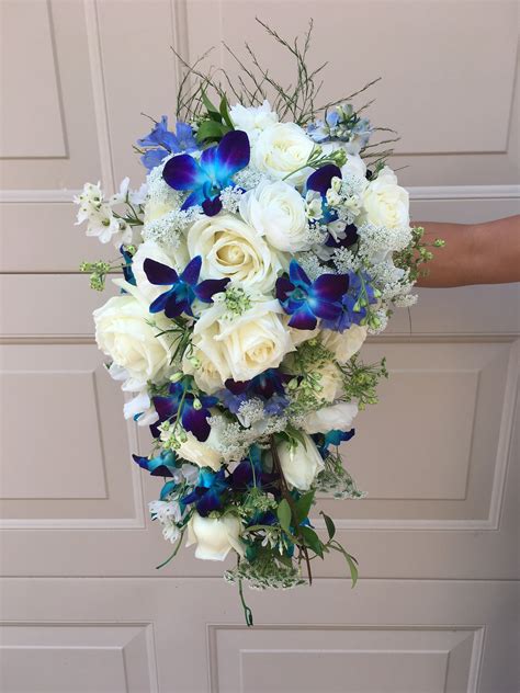cascading bridal bouquet with blue dendrobium or singapore orchids a modern take to a classic