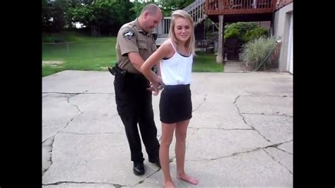 Young Barefoot Woman Learns The Handcuffs At A Police Visit