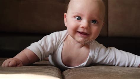 Smiling Adorable Baby Lying Over White Background Stock Photo Image