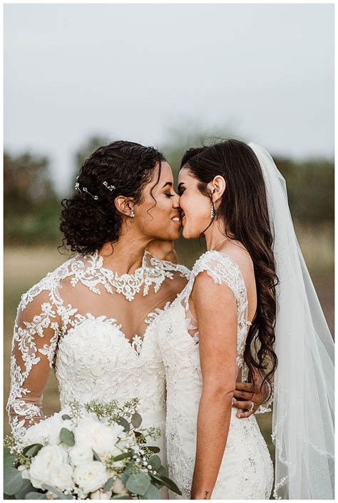 romantic wedding photo lesbian wedding photography kiss a winery wedding with a modern bo