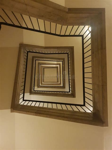 Low Angle Shot Of A Square Staircase Of A Building Stock Photo Image