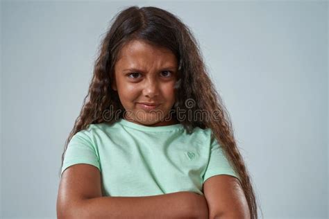 Upset Little Girl With Crossed Arms Look At Camera Stock Image Image