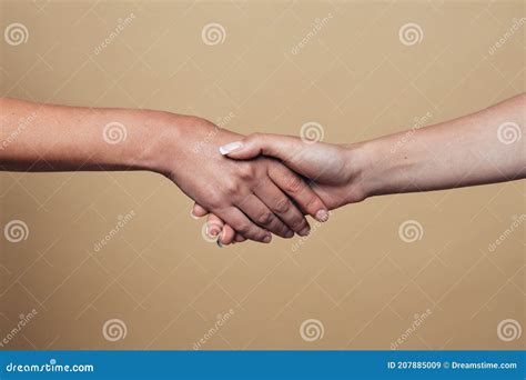 Handshake Two Hands On A Beige Background Stock Image Image Of