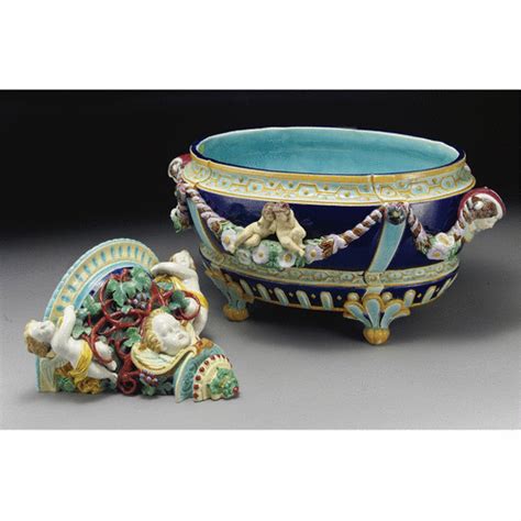 a joseph holdcroft majolica oval jardinière circa 1875 molded in high relief on each side with a