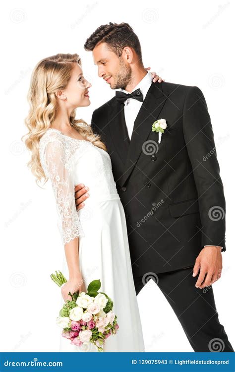 Happy Young Bride And Groom Embracing During Dance And Looking At Each