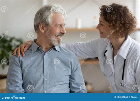 Close Up Friendly Young Woman Caregiver Hugging Smiling Mature Patient Stock Image Image Of