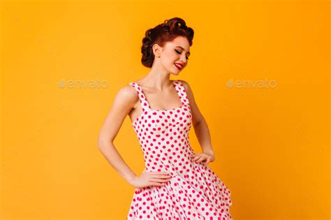 Woman In Polka Dot Dress Posing With Smile Romantic Pinup Girl