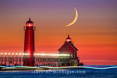 Grand Haven Lighthouse With Crescent Moon And Boat Traffic — Aerial