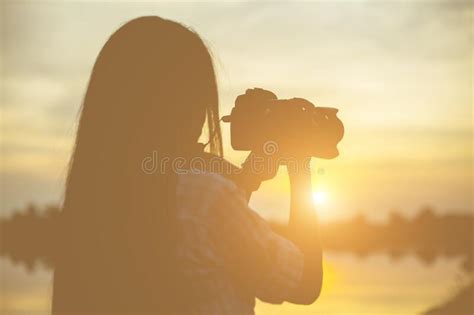 Women Nature Photographer With Digital Camera On The Mountain Stock