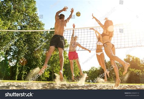 Group Young Friends Playing Volleyball On Royalty Free Image Photo In