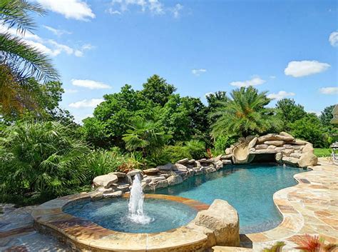 Discover pool deck ideas and landscaping options to create your poolside the existing pool was way too large for the space, it took up the entire back yard. The pool is PebbleTech. It features a weeping wall, built ...