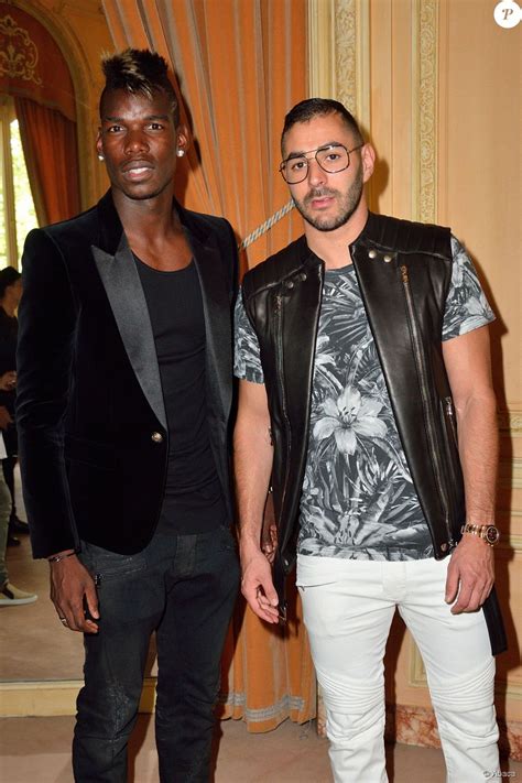 Paul Pogba et Karim Benzema, lors du défilé Balmain's ...