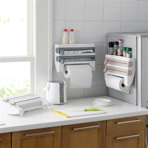 Put six rolls of plastic wrap, foil, plastic bags, and waxed paper at your fingertips. Kitchen Organizer Cling Film Sauce Bottle Storage Rack Tin ...