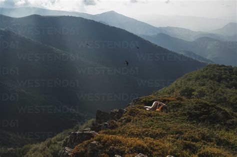 Bulgaria Balkan Mountains Naked Woman Lying On The Ground Stock Photo