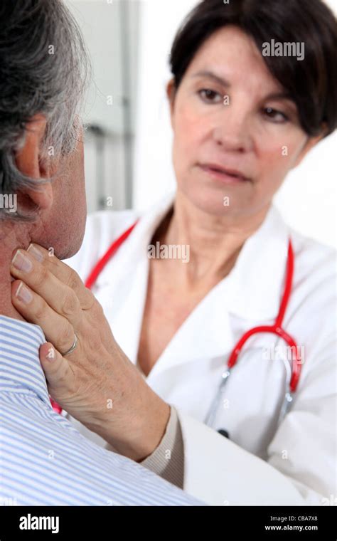 Doctor Examining A Senior Patient Stock Photo Alamy