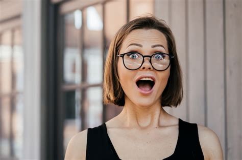 Premium Photo Surprised Pretty Woman In Glasses With Short Straight Hair Having Wide Open