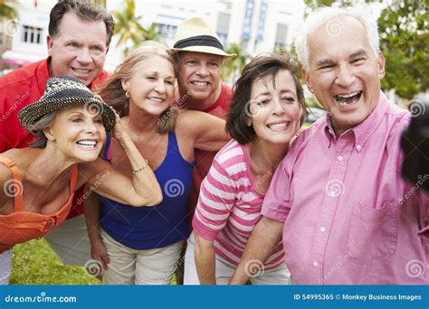 Group Of Senior Friends Taking Selfie In Park Stock Image Image Of