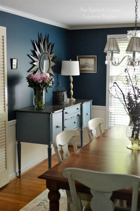 We will return once again from its different shades the design of a very special space, the. Stillwater Blue Sideboard in a Rainstorm Dining Room