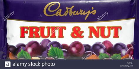 Early recipes included brazil nuts and almonds. Bar of Cadbury's Fruit and Nut chocolate in a retro styled ...