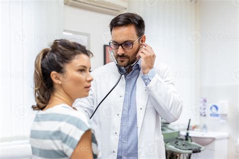 Young Doctor Is Using A Stethoscope Listen To The Heartbeat Of The