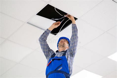Electrician Installing Led Ceiling Light Stock Image Image Of