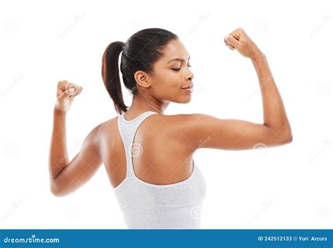 So Strong And Healthy A Young Woman In Gym Clothes Flexing Her Arms