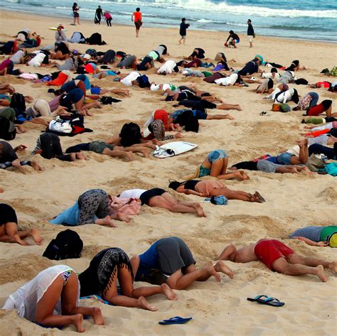 400 People Bury Their Heads In The Sand To Protest