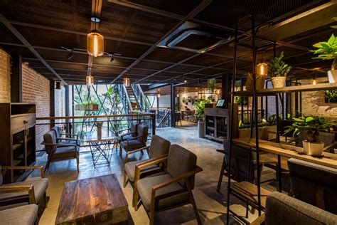 • #madeinaustralia laminated ply & steel rod frame. Le House designs a 'secret garden' café in Hanoi