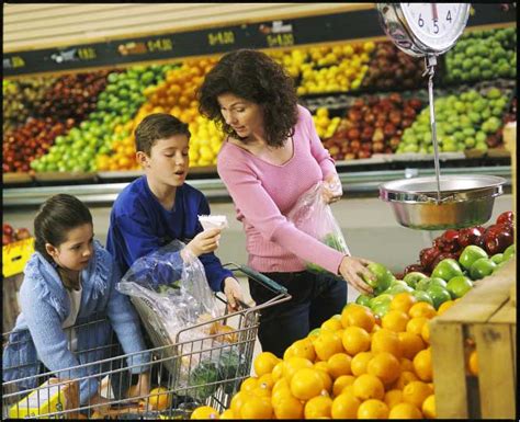 Woman Grocery Shopping With Kids