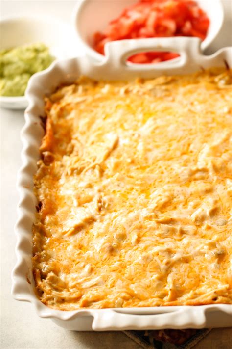 This chicken enchilada bake recipe was one i created many years ago when the fridge and cupboards were your chicken needs to be completely cooked for enchiladas and enchilada casserole. Easy Layered Chicken Enchilada Casserole