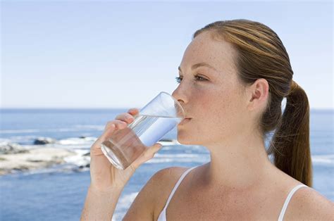 Woman Drinking Fresh Water On Glass Cup During Day Time On The Beach Hd Wallpaper Wallpaper Flare