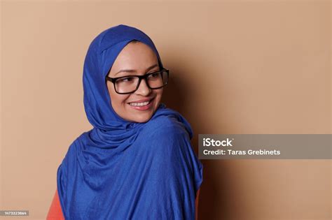 Closeup Middleeastern Muslim Woman Wearing Stylish Spectacles And Hijab Smiling Looking Aside