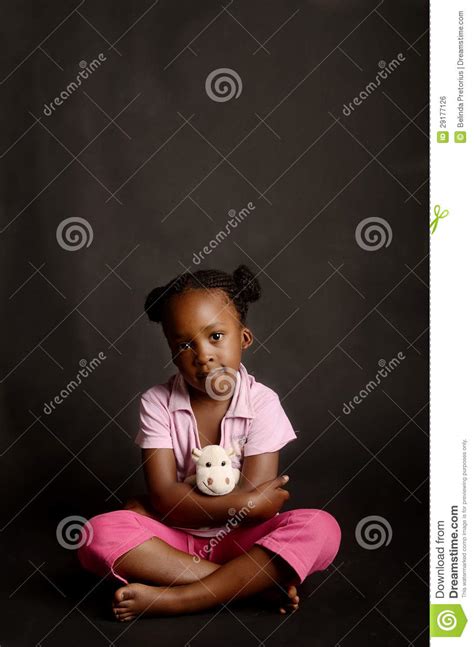 Sad African Little Girl Sitting Alone Stock Photo Image