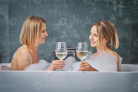 Two Girls Or Couple In Bathroom Having Fun Stock Photo At Vecteezy